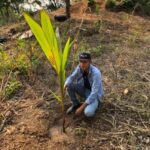 Juan plants a birthday coconut tree